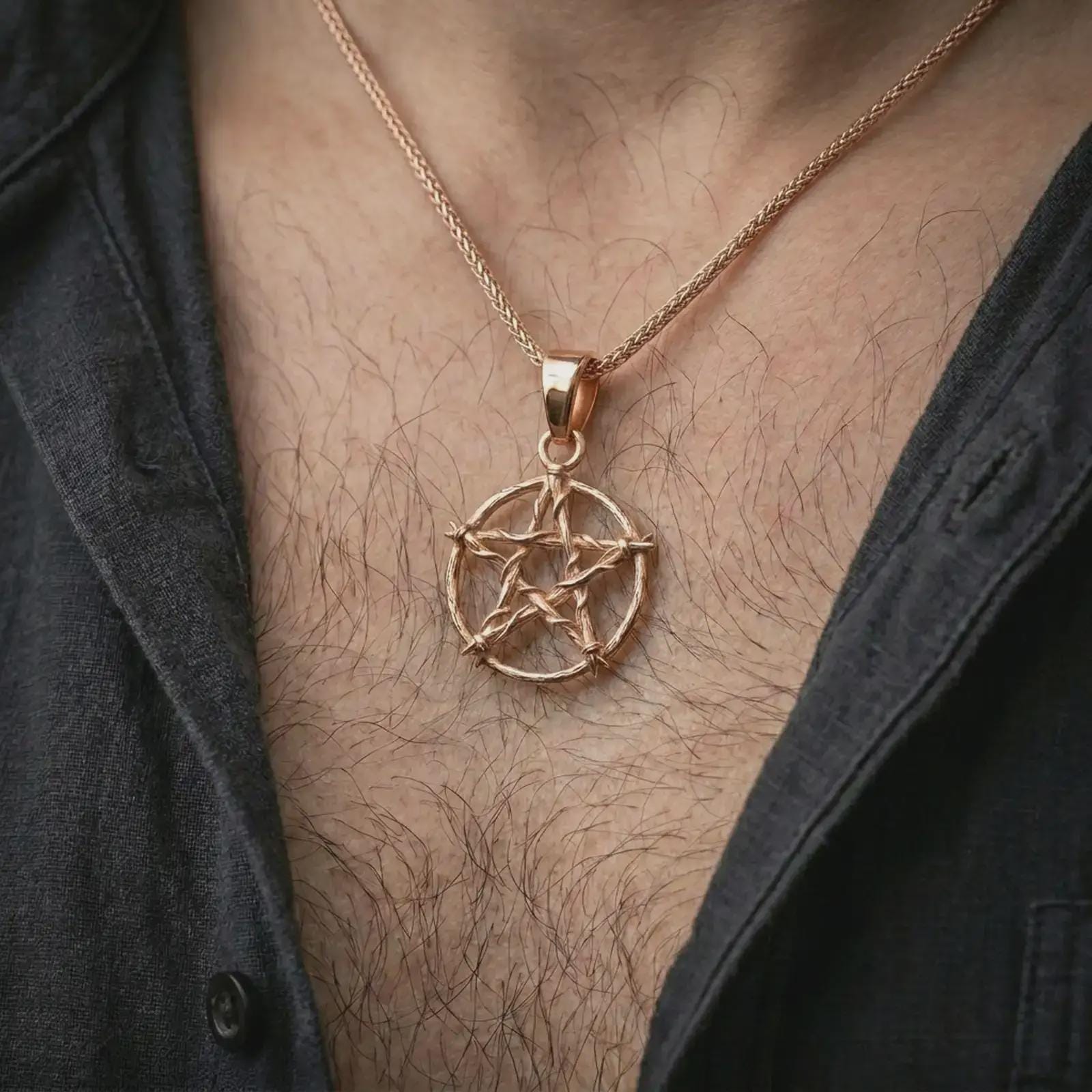 Rose gold plated thorn pentagram pendant necklace worn on the chest, close-up lifestyle shot featuring the thorn star design with warm rose gold tones.