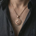 Load image into Gallery viewer, Rose gold plated Lion of Judah pendant necklace worn on the chest, close-up lifestyle shot featuring the Lion of Judah design with warm rose gold tones.
