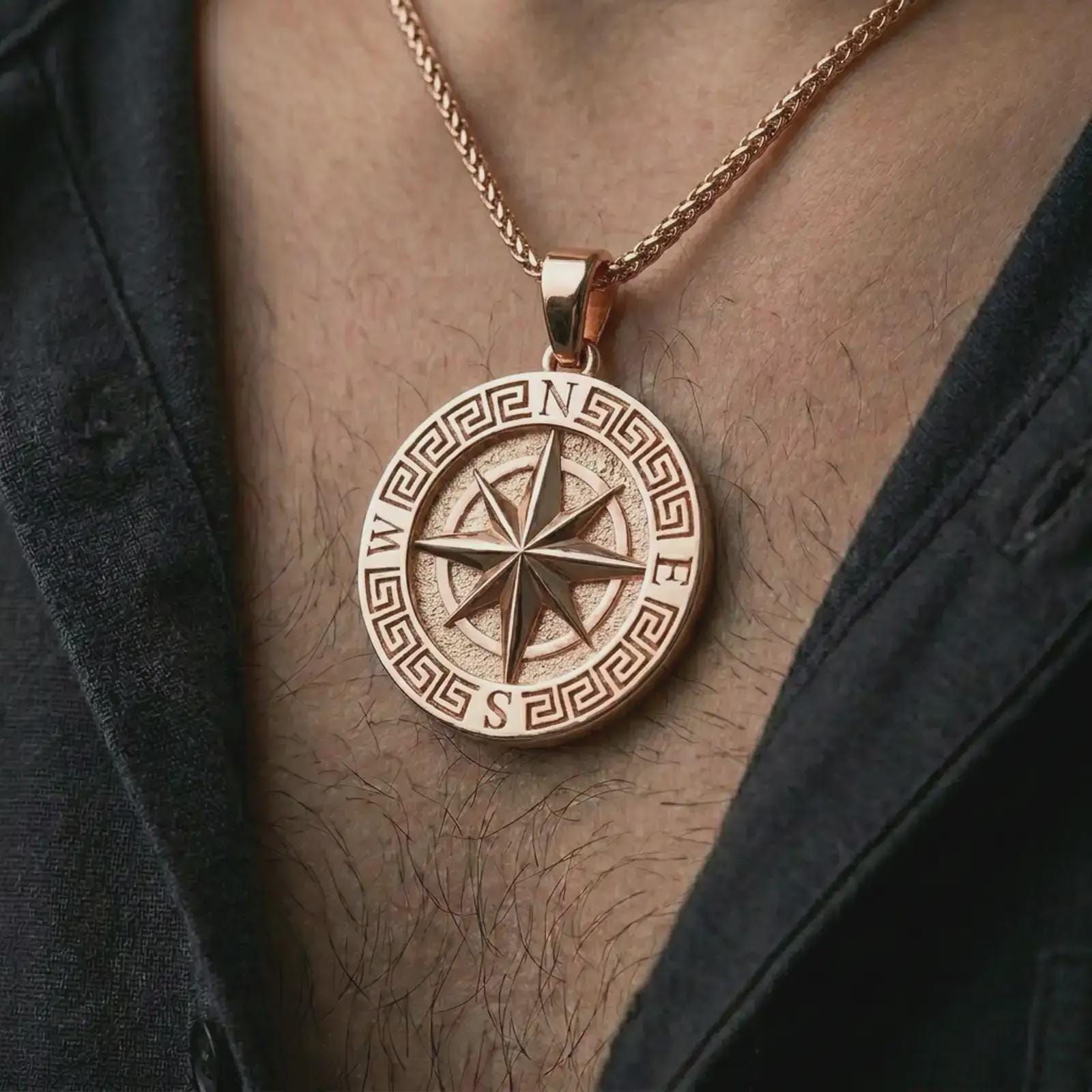 Rose gold plated Greek compass pendant necklace worn on the chest, close-up lifestyle shot featuring the Greek compass design with warm rose gold tones.
