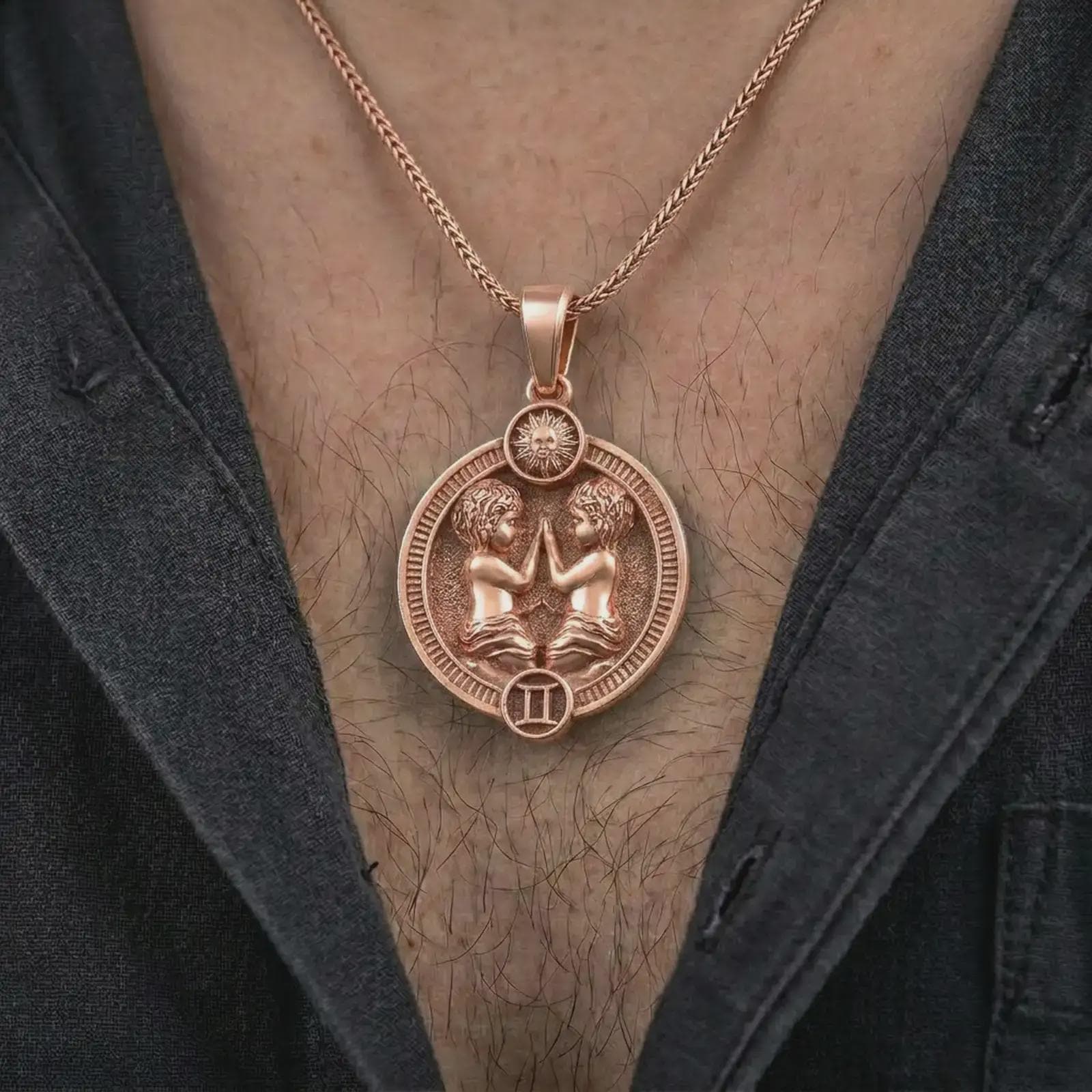 Rose gold plated Gemini zodiac pendant necklace worn on the chest, close-up lifestyle shot featuring the expressive Gemini zodiac design with warm rose gold tones.