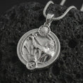 Load image into Gallery viewer, Polished silver Sagittarius zodiac pendant necklace on textured volcanic rock, centered macro jewelry photo with detailed archer horoscope relief and bright silver highlights.
