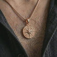 Load image into Gallery viewer, Rose gold plated compass rose pendant necklace worn on the chest, close-up lifestyle shot featuring the explorer compass design with warm rose gold tones.
