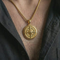 Load image into Gallery viewer, Gold plated compass pendant necklace worn on the chest, premium lifestyle jewelry photo with the explorer compass pendant centered on a spiga chain.
