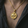 Load image into Gallery viewer, Gold plated Taurus zodiac pendant necklace worn on the chest, premium lifestyle jewelry photo with the Taurus bull pendant centered on a spiga chain.
