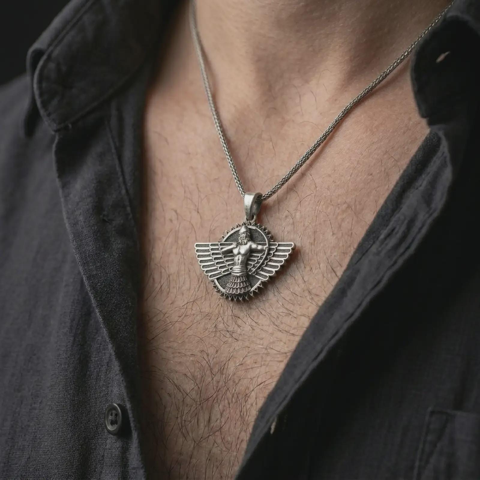 An oxidized Faravahar pendant is worn on the neck in a close-up lifestyle shot, centered on the chest as a meaningful Persian heritage necklace.