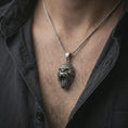 Load image into Gallery viewer, An oxidized gorilla pendant is worn on the neck in a close-up lifestyle shot, centered on the chest as a bold masculine animal amulet.
