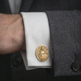 Load image into Gallery viewer, A gold plated Mary Magdalene cufflink is worn on a white cuff in a close-up lifestyle shot, styled as a thoughtful religious gift for men.
