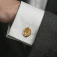 Load image into Gallery viewer, A gold plated Pensive Christ cufflink is worn on a white cuff in a close-up lifestyle shot, styled as a thoughtful religious gift for Christian men.
