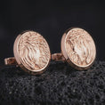 Load image into Gallery viewer, Rose gold plated Jesus Crown of Thorns cufflinks are photographed on porous volcanic rock in a close-up studio composition with refined luxury lighting and religious detail.

