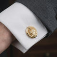 Load image into Gallery viewer, Gold plated Saint Joseph cufflinks worn on a crisp white cuff with a tailored suit in a premium lifestyle composition, presenting a meaningful Christian accessory for men.
