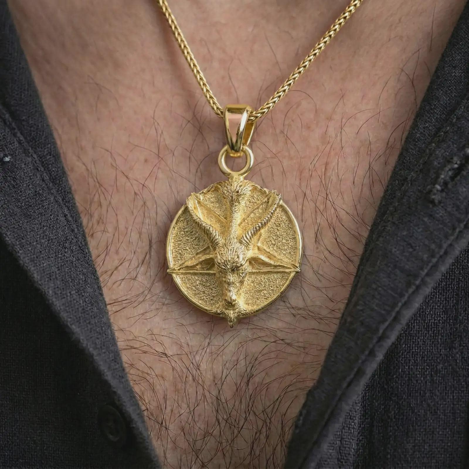 Gold plated goat pentagram pendant necklace worn on the chest, premium lifestyle jewelry photo with the occult goat pendant centered on a spiga chain.