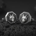 Load image into Gallery viewer, An oxidized fox head cufflink pair rests on dark volcanic rock in a macro studio close-up, showing sculpted woodland animal detail inside octagon frames.
