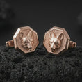 Load image into Gallery viewer, Rose gold plated fox head cufflinks are photographed on porous volcanic rock in a close-up studio composition with refined luxury lighting and detailed fox features.
