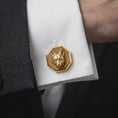 Load image into Gallery viewer, A gold plated fox head cufflink is worn on a white cuff in a close-up lifestyle shot, styled as a meaningful groomsmen accessory for men.
