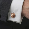 Load image into Gallery viewer, A rose gold plated lioness head cufflink is worn on a shirt cuff in a close-up lifestyle composition, highlighting its octagon frame and sculpted lioness design.
