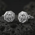 Load image into Gallery viewer, Polished silver octopus cufflinks are displayed on black volcanic rock in a premium macro studio close-up with detailed tentacle texture and clean geometric edges.
