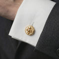 Load image into Gallery viewer, A gold plated octopus cufflink is worn on a white cuff in a close-up lifestyle shot, styled as a meaningful ocean lover gift for men.
