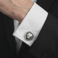 Load image into Gallery viewer, An oxidized bear head cufflink is worn on a white shirt cuff in a close-up lifestyle shot, styled with a dark suit for a rugged formal look.
