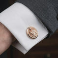 Load image into Gallery viewer, Rose gold plated Saint Joseph cufflinks featured on a formal dress shirt cuff in a luxury lifestyle close-up, displaying the Saint Joseph and Christ Child relief with elegant craftsmanship.
