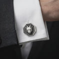Load image into Gallery viewer, An oxidized fox head cufflink is worn on a white shirt cuff in a close-up lifestyle shot, styled with a dark suit for a refined woodland-inspired look.
