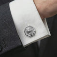 Load image into Gallery viewer, A polished silver tiger head cufflink is worn on a shirt cuff in a premium close-up lifestyle image, showing the sculpted roaring tiger face clearly.
