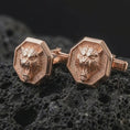 Load image into Gallery viewer, Rose gold plated tiger head cufflinks are photographed on porous volcanic rock in a close-up studio composition with refined luxury lighting and detailed tiger features.
