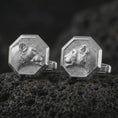 Load image into Gallery viewer, Polished silver lioness head cufflinks are displayed on black volcanic rock in a premium macro studio close-up with soft facial texture and clean geometric edges.
