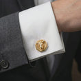 Load image into Gallery viewer, A gold plated bull head cufflink is worn on a white cuff in a close-up lifestyle shot, styled as a meaningful Taurus gift for men.
