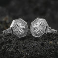 Load image into Gallery viewer, Polished silver lion profile cufflinks are displayed on black volcanic rock in a premium macro studio close-up with detailed mane texture and clean geometric edges.
