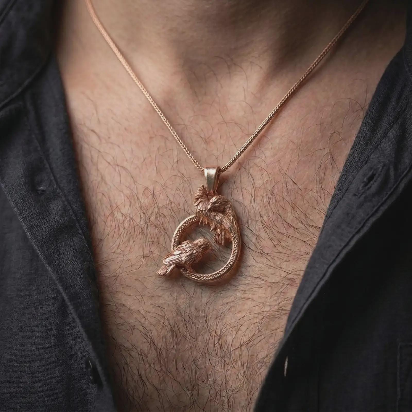 Rose gold plated Hugin and Munin ravens pendant necklace worn on the chest, close-up lifestyle shot featuring the Norse raven pair design with warm rose gold tones.