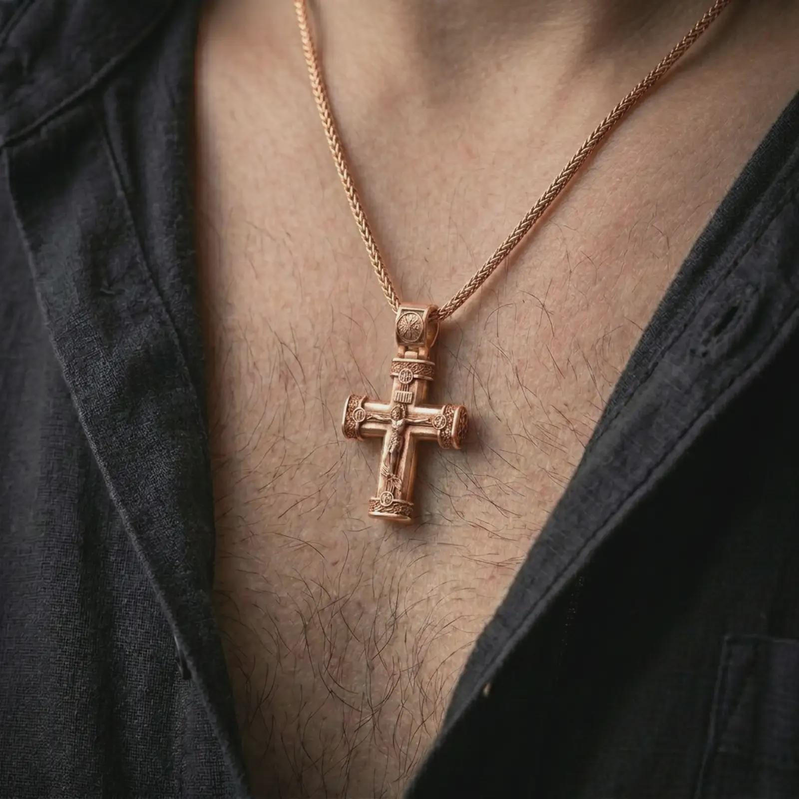 Rose gold plated crucifix cross pendant necklace worn on the chest, close-up lifestyle shot featuring the sacred crucifix design with warm rose gold tones.