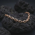 Load image into Gallery viewer, Rose gold plated anchor link bracelet on volcanic rock, showing a warm finish over a rugged men’s chain design.
