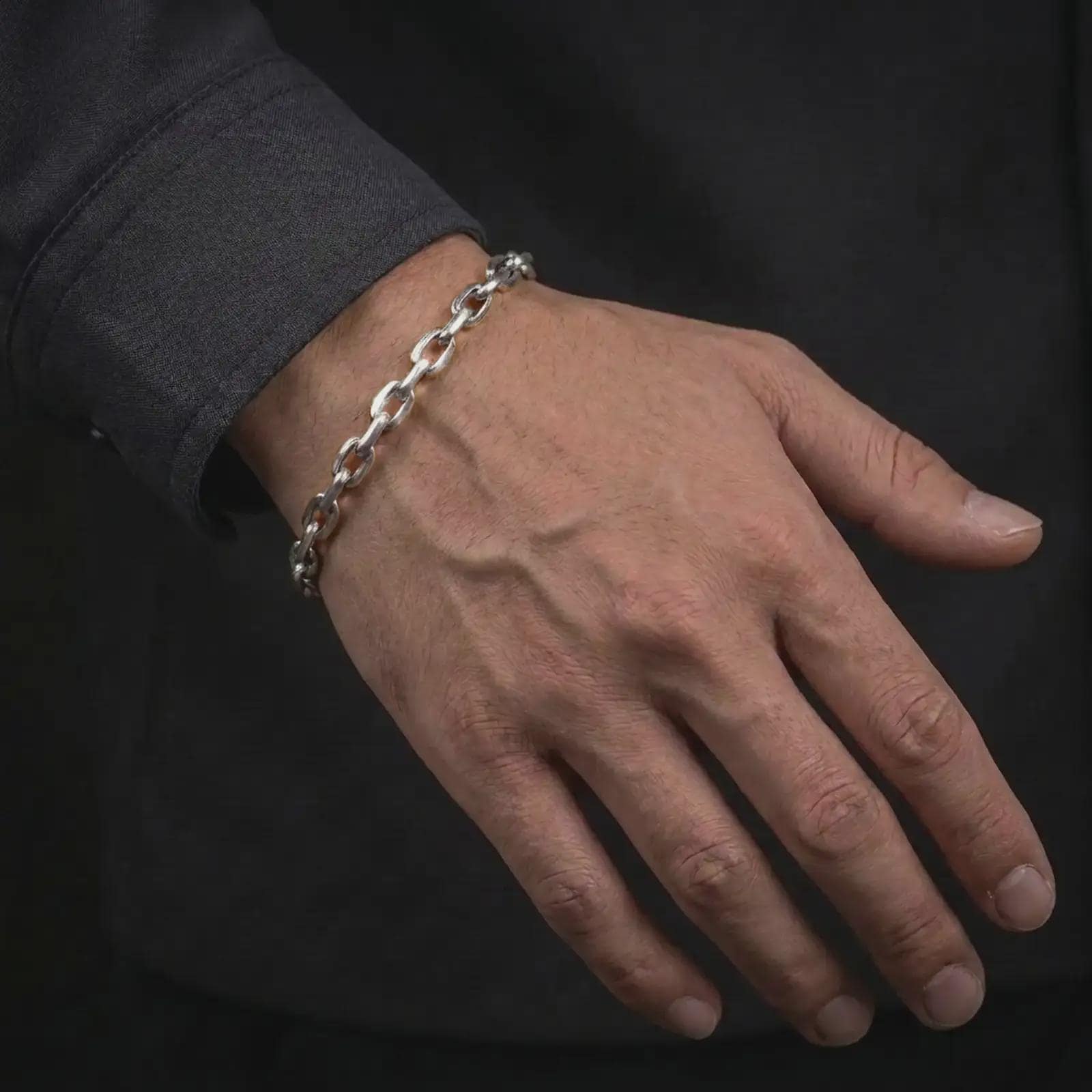 Polished sterling silver mariner bracelet worn on the wrist, showing its smooth link profile and balanced fit.