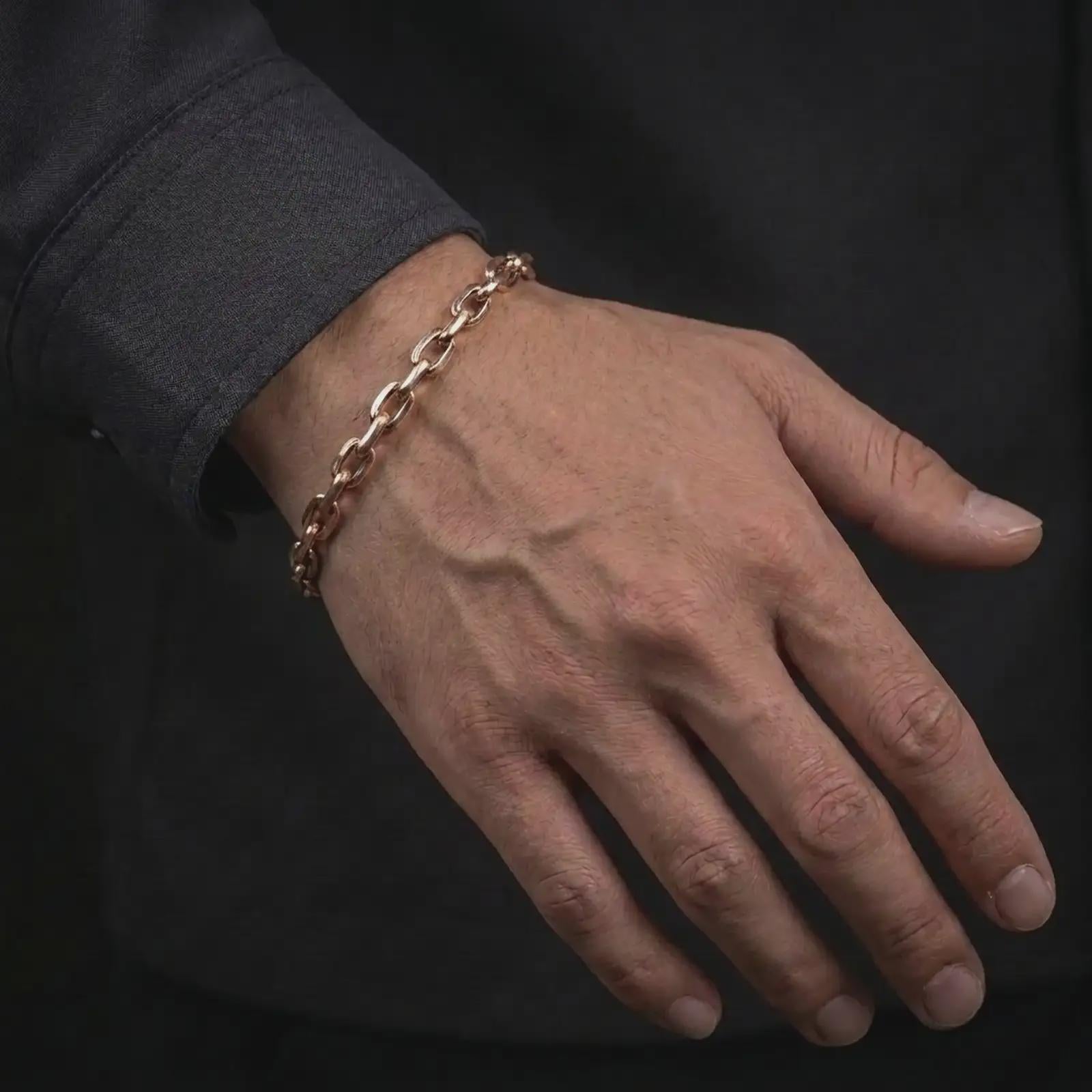 Rose gold plated mariner link bracelet worn on the wrist, combining a warm finish with a strong masculine chain style.