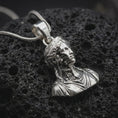 Load image into Gallery viewer, Polished silver architectural bust pendant on volcanic rock in dark macro studio close-up
