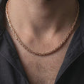 Load image into Gallery viewer, The rose gold plated 4mm square Byzantine chain necklace is worn naturally on a man’s chest, showcasing its intricate square Byzantine pattern and elegant masculine finish in a detailed lifestyle shot.
