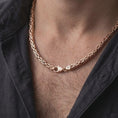 Load image into Gallery viewer, The rose gold plated Byzantine necklace is worn naturally on a man’s chest, showcasing the dimensional round links, flexible structure, and bold masculine jewelry style.
