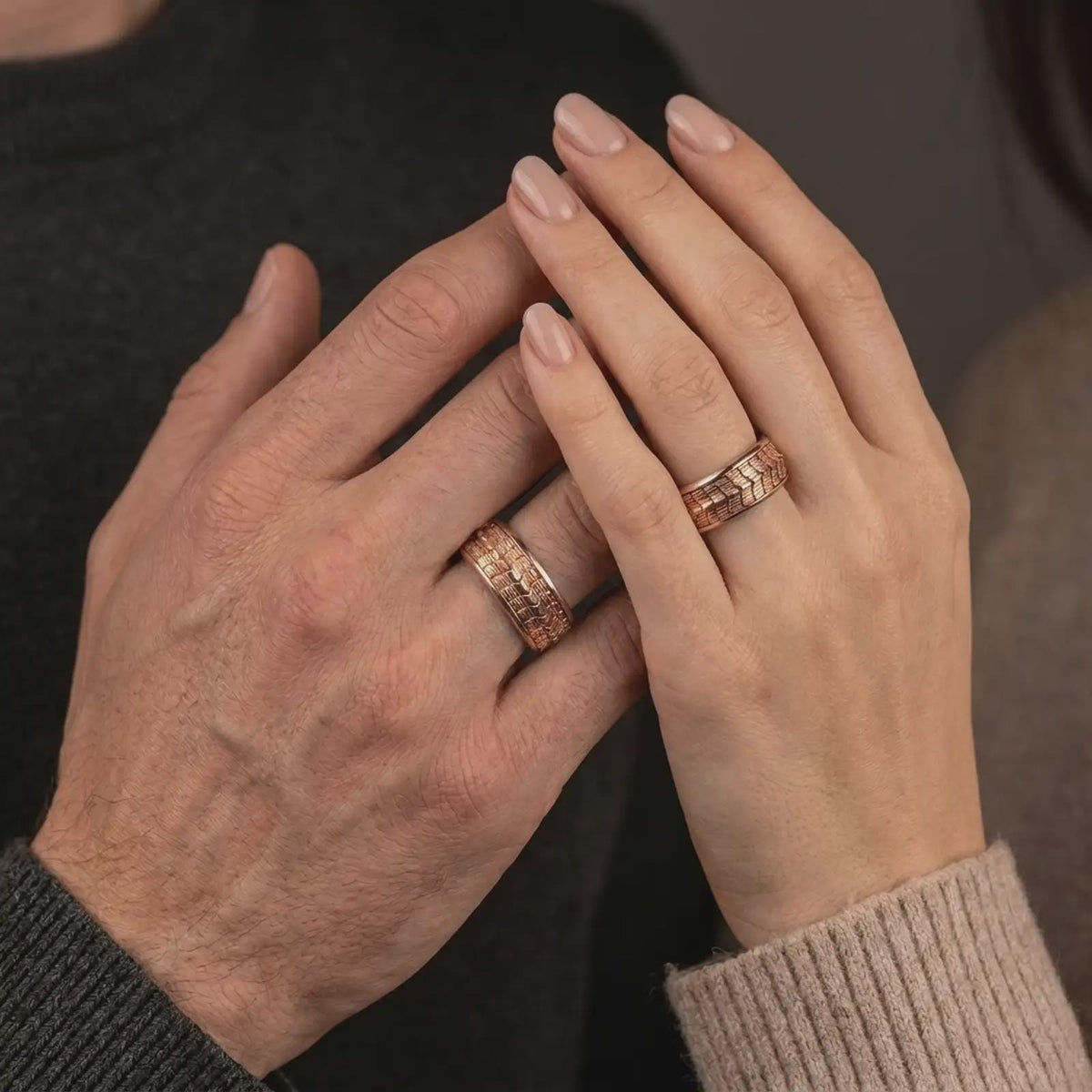 A rose gold plated reptile spinner ring is worn on a human hand, showcasing the textured lizard scale motif, elegant rotating band, and distinctive animal-inspired jewelry style in a premium lifestyle photograph.