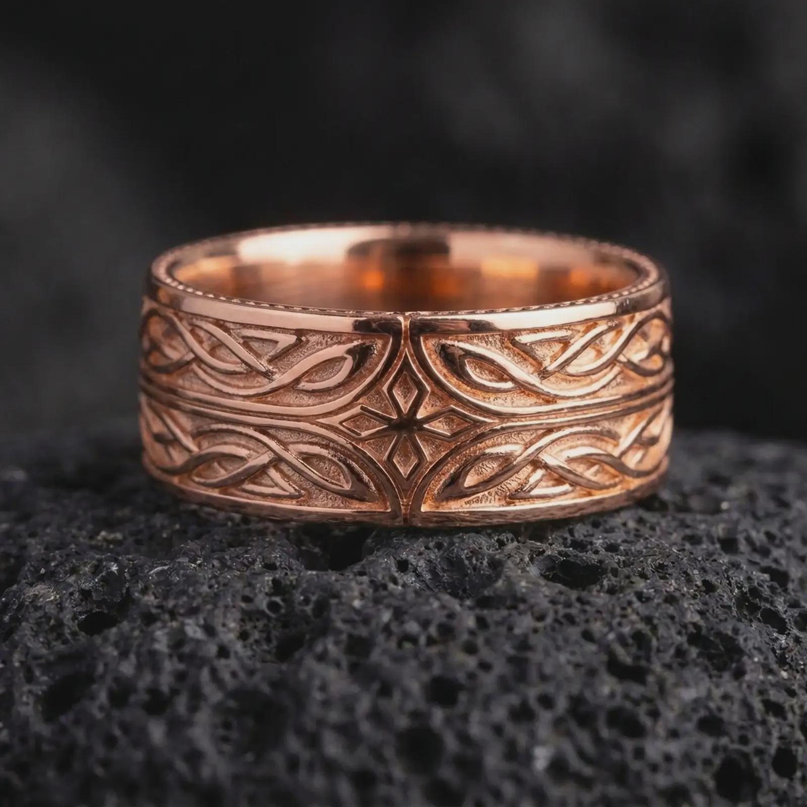 The rose gold plated Elven knotwork ring is arranged on black volcanic rock, emphasizing its mystical star centerpiece, continuous interwoven pattern, and refined fantasy-inspired band profile in a detailed macro image.