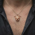 Load image into Gallery viewer, The rose gold plated ant pendant is worn on the chest, showcasing the dimensional insect face, prominent jaws, segmented antennae, textured compound eyes, and distinctive entomology-inspired jewelry design.
