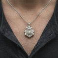 Load image into Gallery viewer, A polished silver King Gorilla Samurai pendant worn on a man's chest, showcasing the detailed gorilla head, decorative helmet crown, sculpted facial features, and bold statement necklace design.
