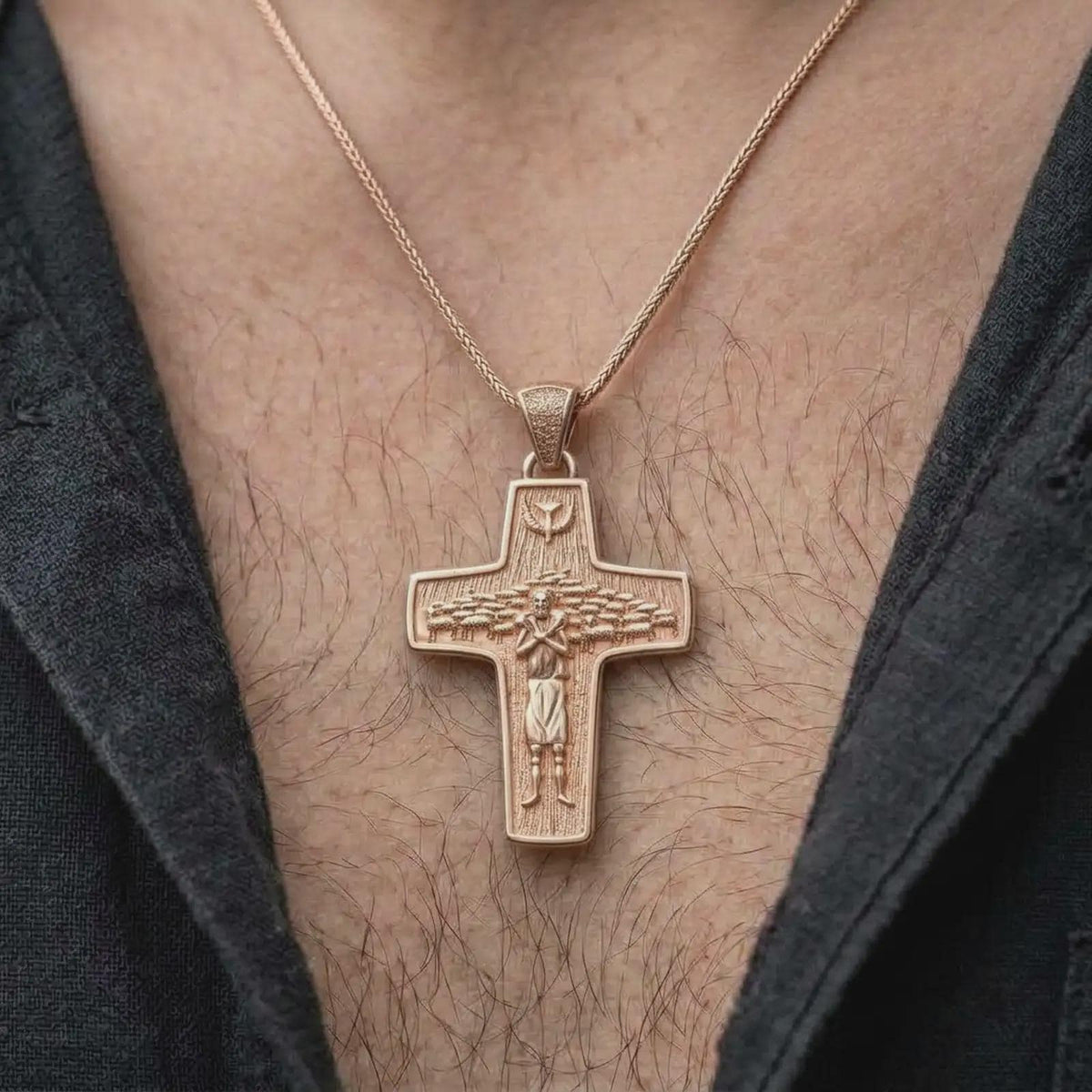 The rose gold plated Good Shepherd cross necklace is worn on the chest, showcasing the sculptural shepherd figure, surrounding sheep, dove symbol, and elegant Christian devotional jewelry design.