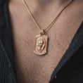 Load image into Gallery viewer, Rose gold plated bear family pendant worn on the chest, showcasing the parent bear and cub, textured medallion background, and meaningful wildlife-inspired necklace design.
