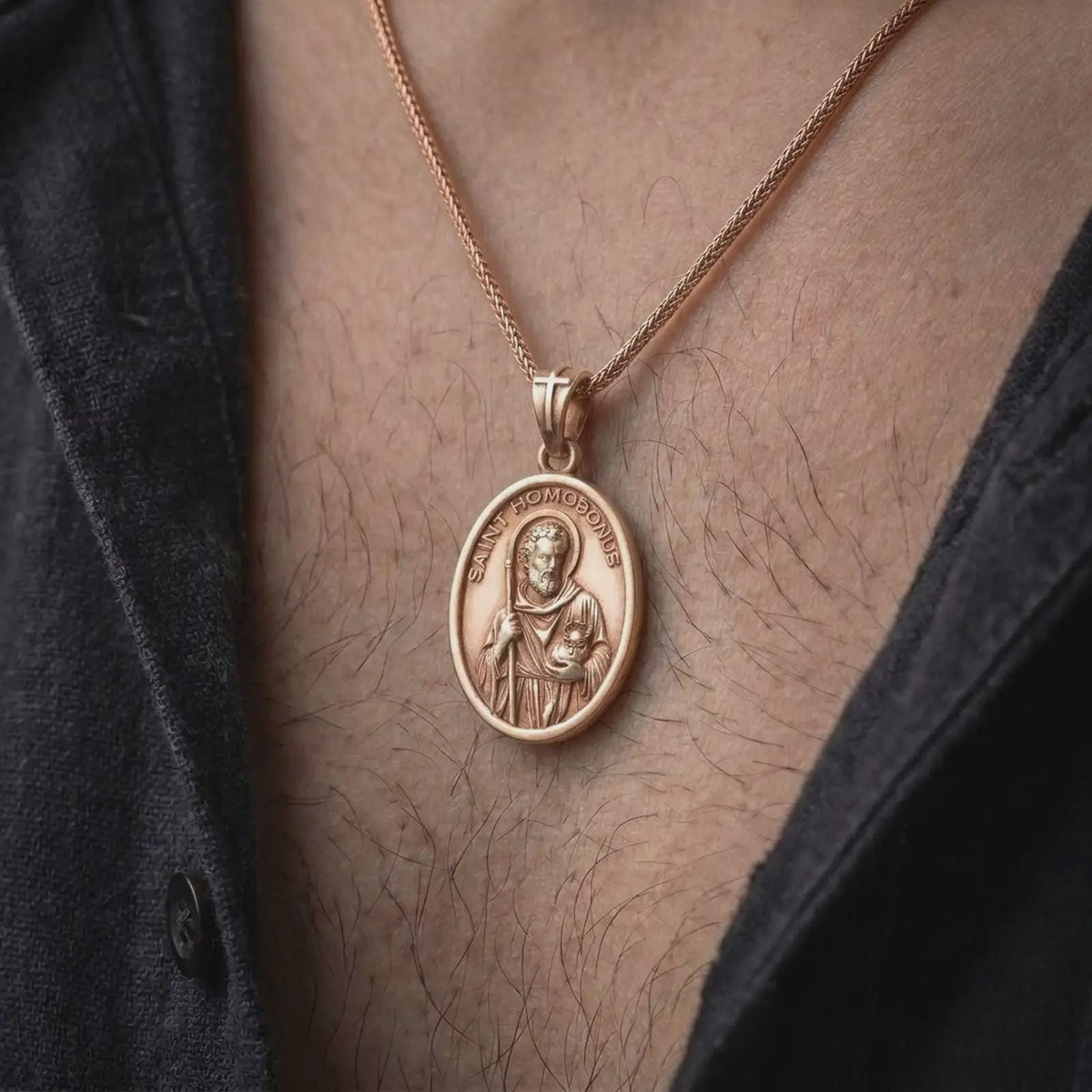 Rose gold plated Saint Homobonus medal worn on the chest, showcasing the religious portrait, oval frame, and faith-inspired pendant for entrepreneurs and business owners.