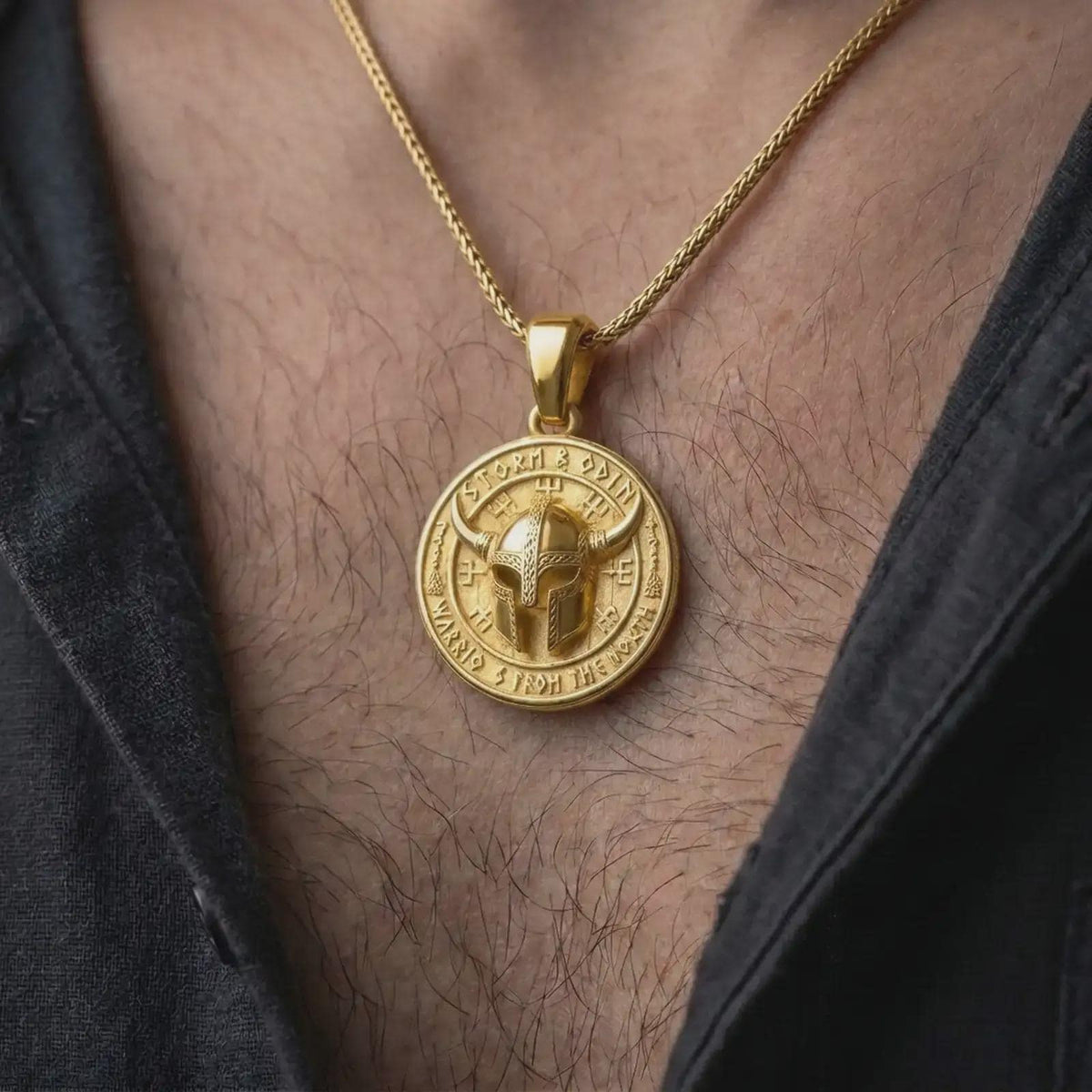 Gold plated Viking warrior necklace worn on the chest, highlighting the horned helmet, Nordic-inspired symbols, circular medallion shape, and bold men's jewelry design.