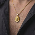 Load image into Gallery viewer, Gold plated wolf necklace worn on the chest, highlighting the detailed wolf face, layered fur, alert expression, and symbolic animal pendant aesthetic.
