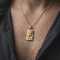 Load image into Gallery viewer, Gold plated Gemini zodiac necklace worn on the chest, highlighting the dimensional twin face portraits, bold geometric frame, and symbolic astrology-inspired pendant design.
