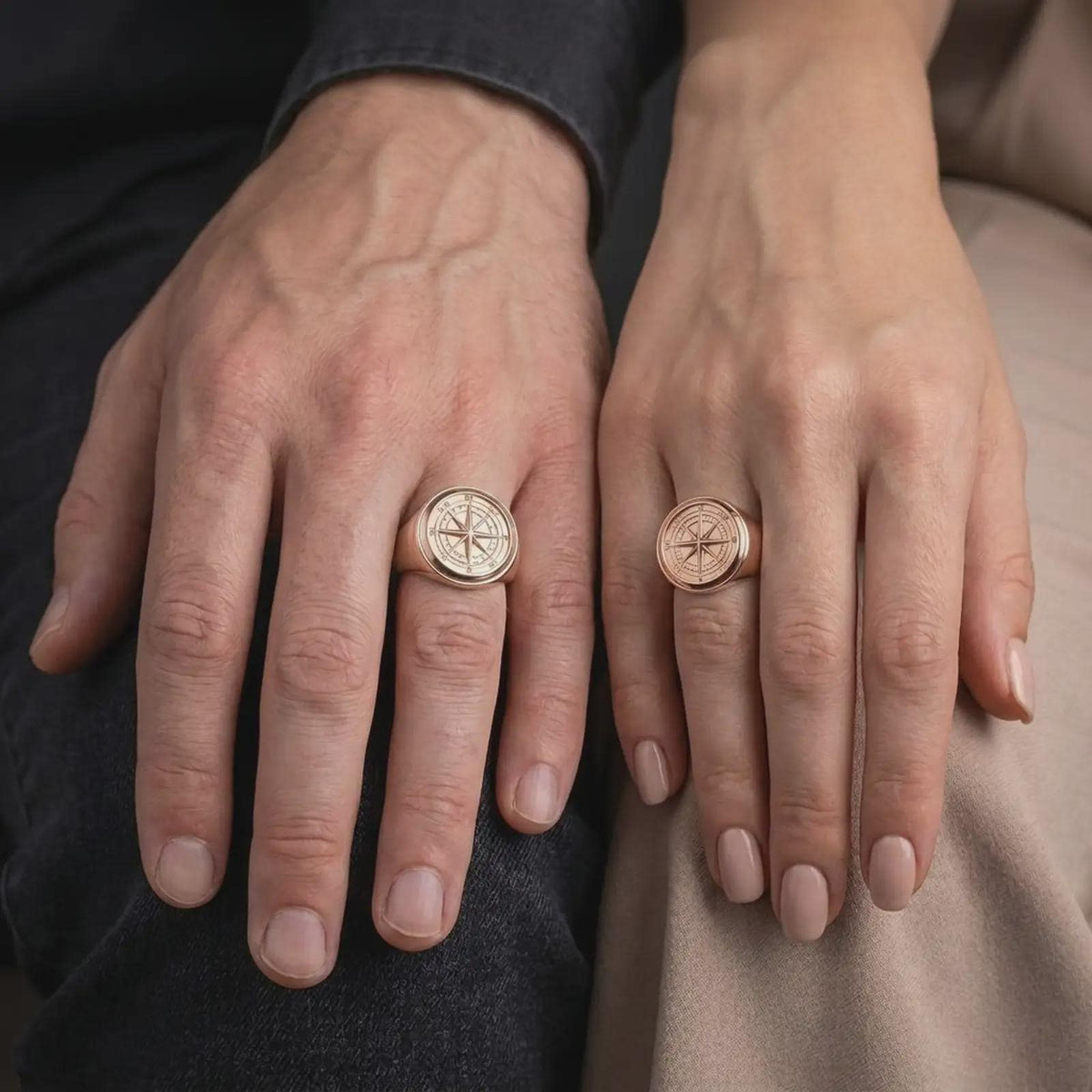 Rose gold plated compass rose ring worn on the hand, showcasing the sculpted navigation star, detailed directional dial, substantial signet band, and symbolic travel-inspired jewelry aesthetic.