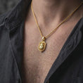 Load image into Gallery viewer, Gold plated stag beetle necklace worn on the chest, highlighting the raised insect sculpture, prominent mandibles, segmented beetle body, and distinctive nature-inspired gothic jewelry aesthetic.
