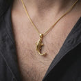 Load image into Gallery viewer, Gold plated koi fish necklace worn on the chest, highlighting the detailed carp shape, textured scales, flowing tail, and meaningful good luck jewelry design.
